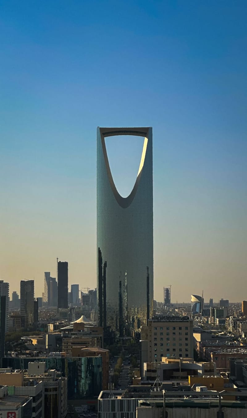 The Kingdom Centre tower rising above the Riyadh skyline in the late afternoon haze