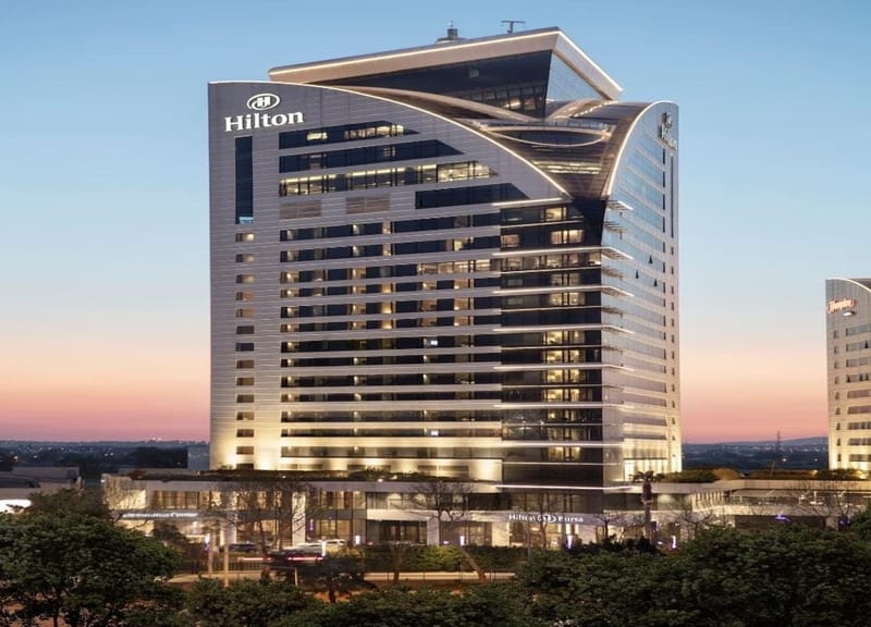 The Hilton Bursa Convention Center & Spa lit against a pink and blue dusk